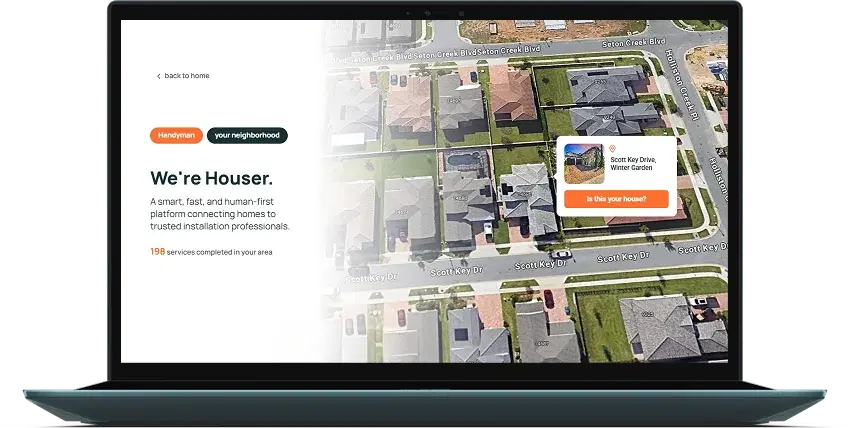 Laptop showing the Houser platform over a satellite image of a residential neighborhood